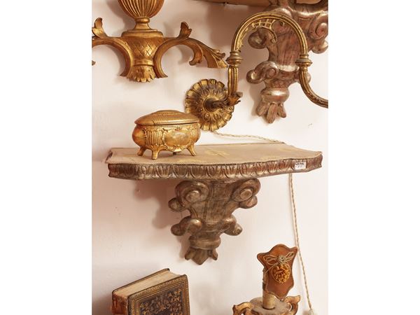 Pair of carved and silvered wooden shelves