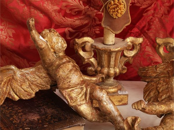 Pair of carved and gilded wooden cherubs