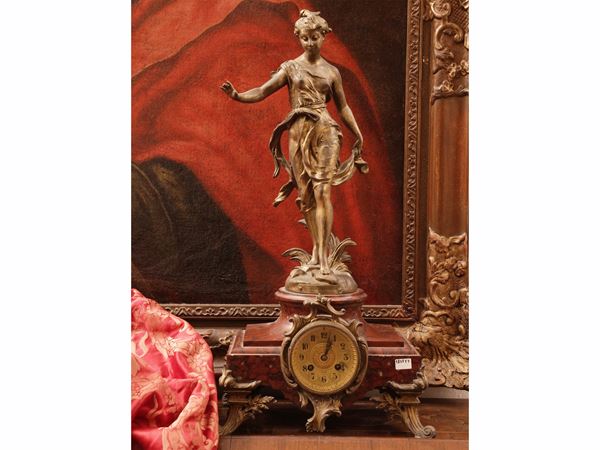 Table clock in golden antimony and red marble