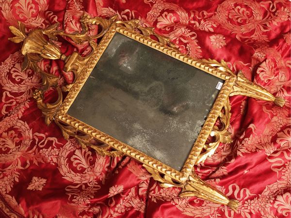 Specchiera in legno intagliato e dorato