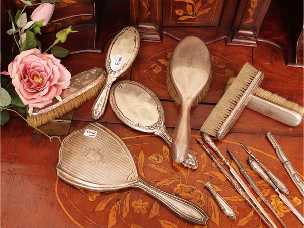 Assortment of silver-coated toilet accessories