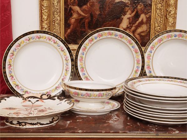 Set of decorative earthenware plates and accessories