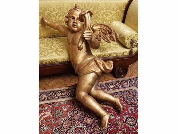 Large wall sculpture in carved and gilded wood