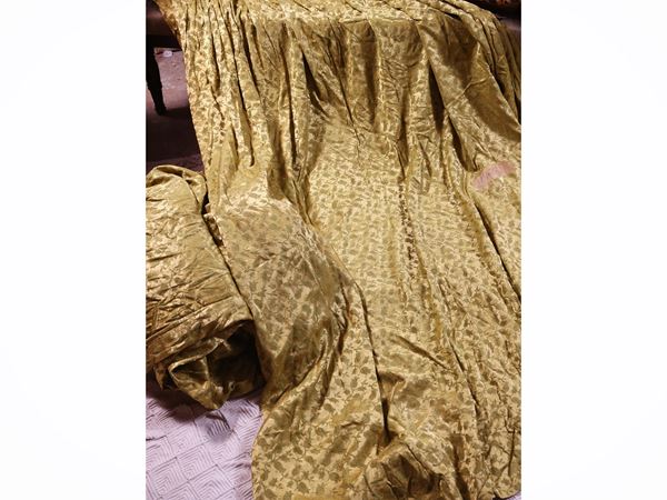 Series of four curtains in gold-colored damask fabric