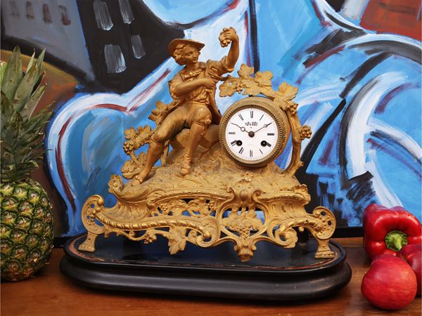 Antimony table clock in golden metal
