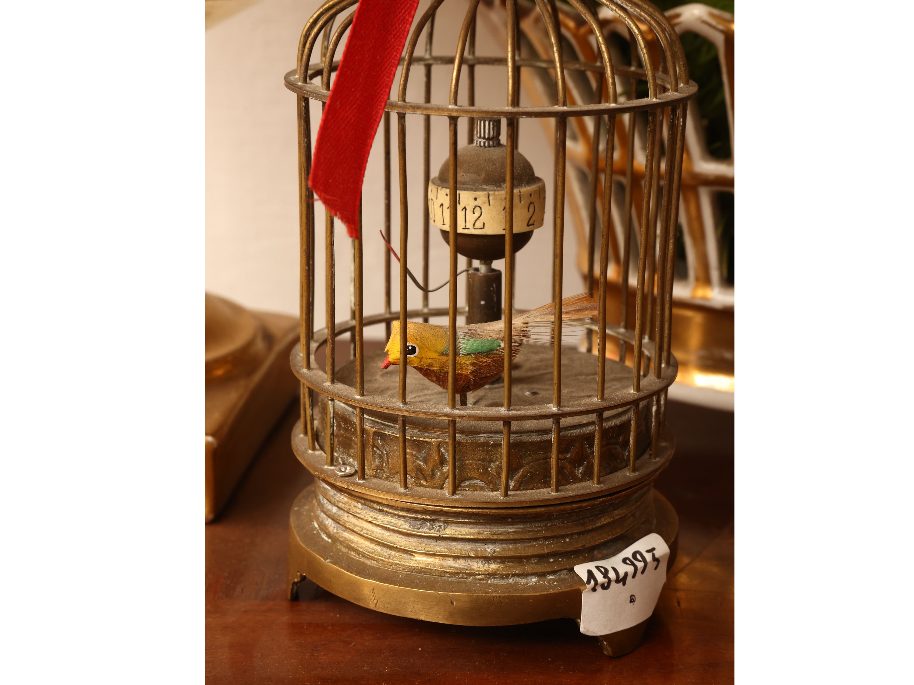 Piccolo orologio da tavolo a foggia di gabbietta