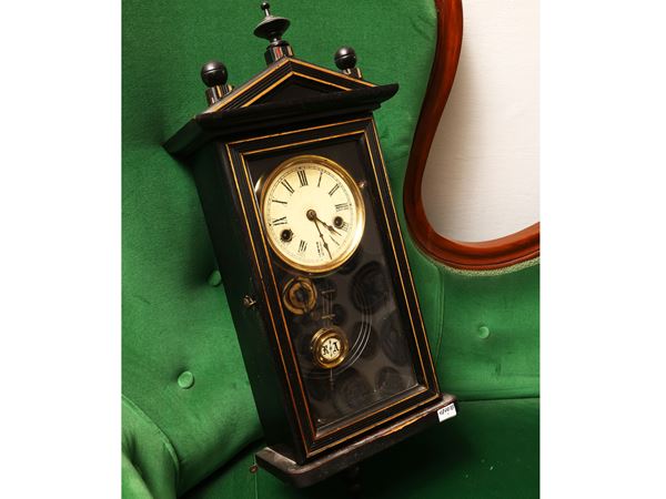 Wall clock in ebonized wood