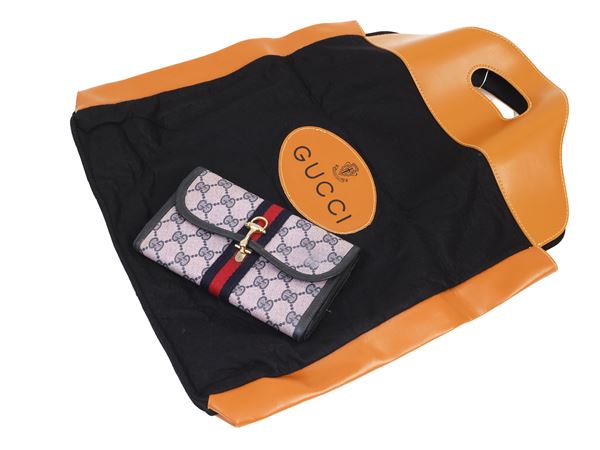 Gucci - Portafoglio in tessuto GG blu