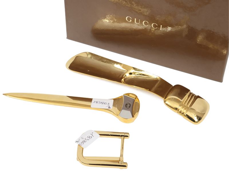 Gucci - Tre accessori in ottone dorato