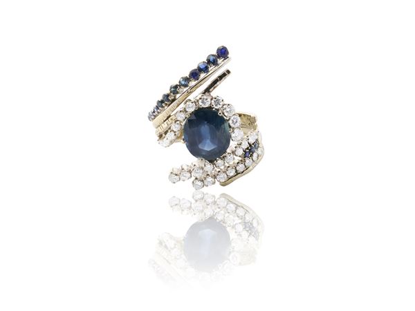 Anello contrariè  in oro bianco, diamanti e zaffiro