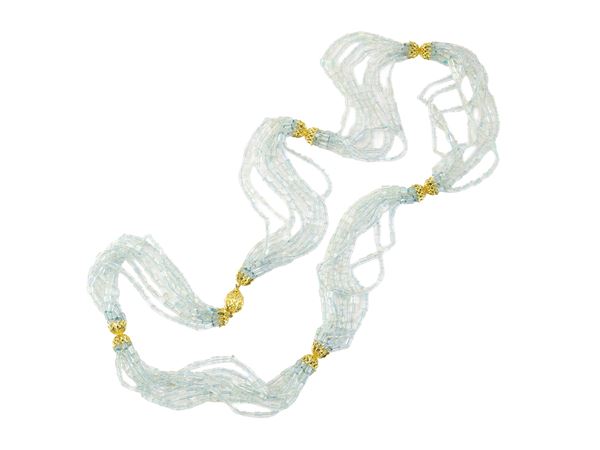 Lunga collana in oro giallo e pietre incolori