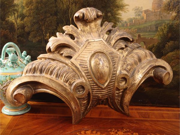 Pair of carved and gilded wooden canopy crowns