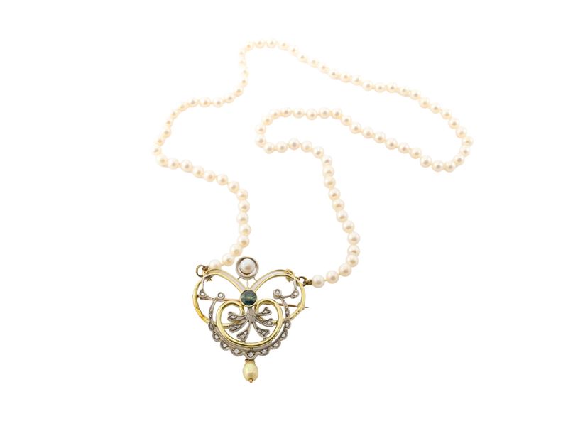 Spilla in oro 9Kt e argento con filo di perle bianche coltivate