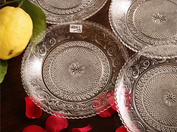 Twelve pressed glass saucers, Arabesque model, Baccarat