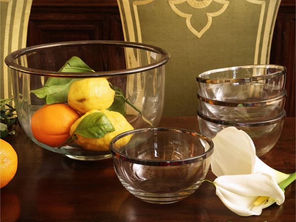 Glass table set bound in silver metal