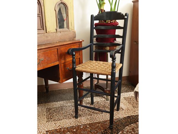Rustic armchair in ebonized wood