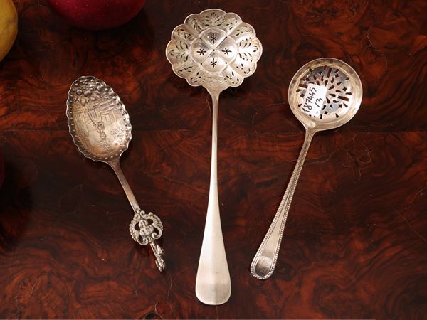 Three collectible silver spoons