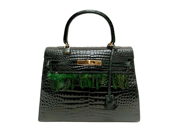 Green leather handbag with a crocodile-embossed finish