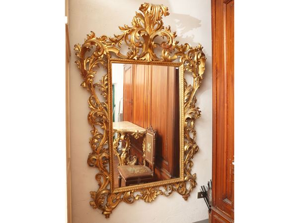 Large mirror with carved and gilded wooden frame