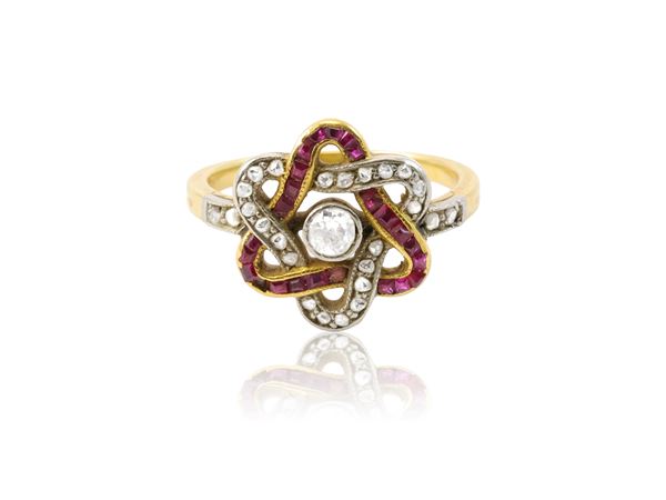 A 18K yellow gold and silver cluster swirl ring set with diamonds and rubies