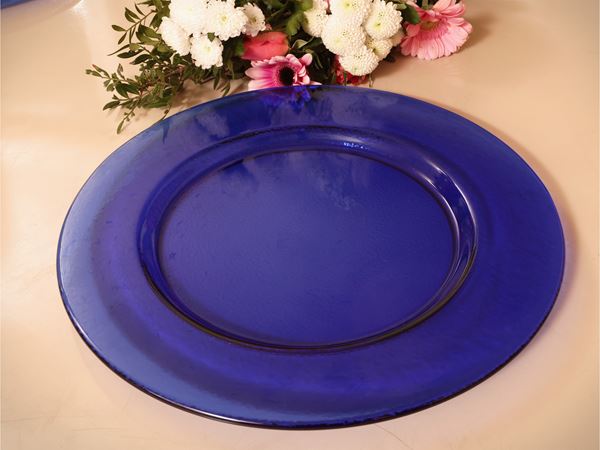Serie di dodici sottopiatti in vetro blu
