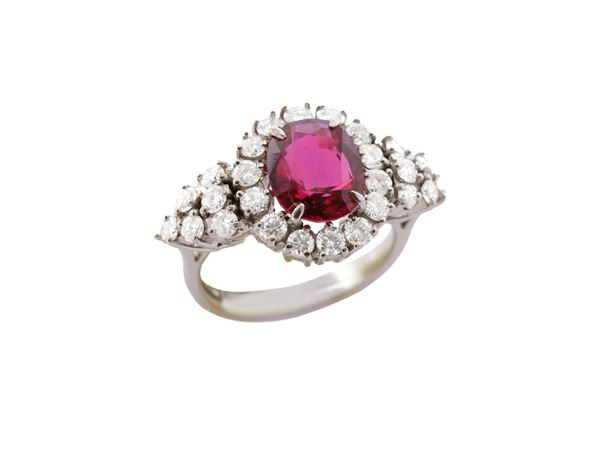 A 18K white gold, ruby and diamonds ring