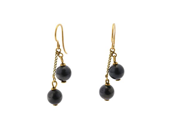 Two pairs of 18K yellow gold, pearl and gray spheres earrings