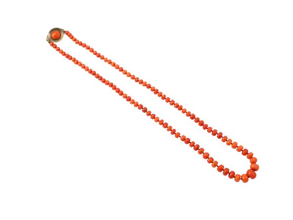 A red coral necklace with 9K gold clasp