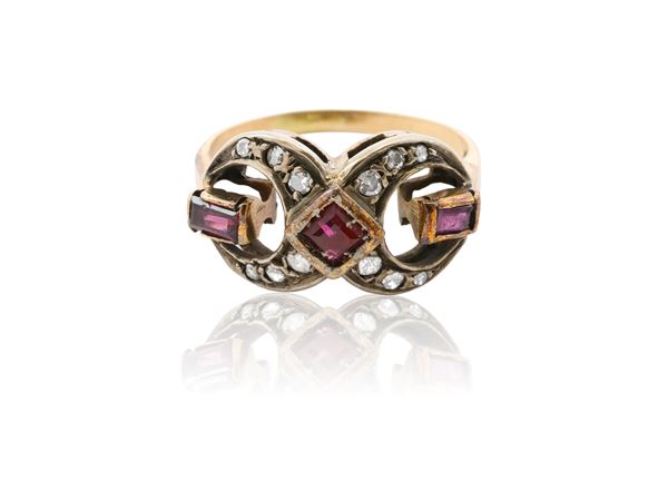 A 9Kt gold, silver, rubies and diamonds ring
