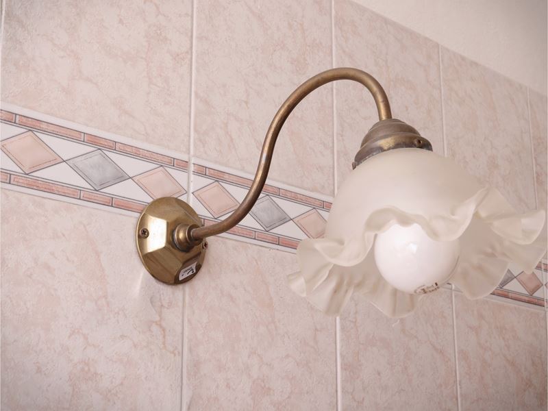 Due Complementi per L'illuminazione in Metallo Dorato