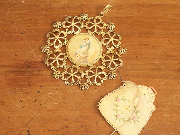 Gilded copper filigree cradle medal