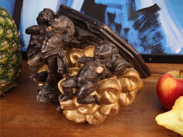 Shelf in ebonized and gilded wood
