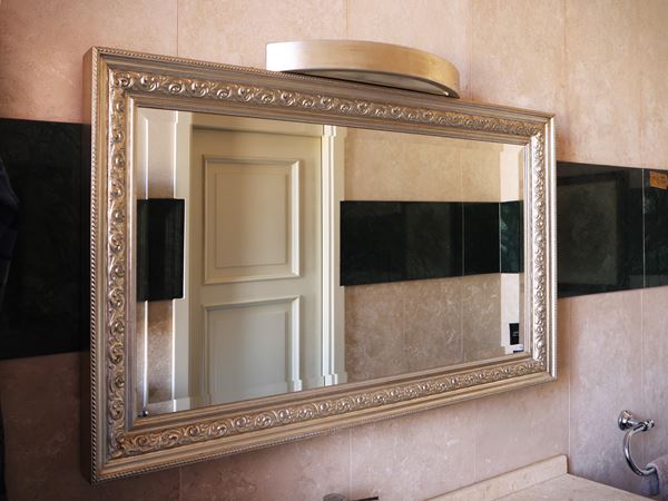 Mirror with silvered wooden frame