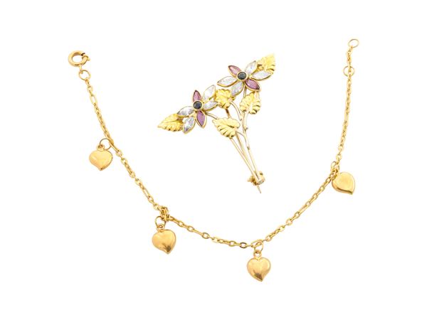 A 18K gold bracelet and brooch
