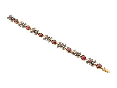 Bracciale in oro giallo 18 kt con granati cabochon e rubini