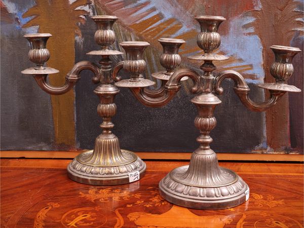 Pair of silver metal candlesticks