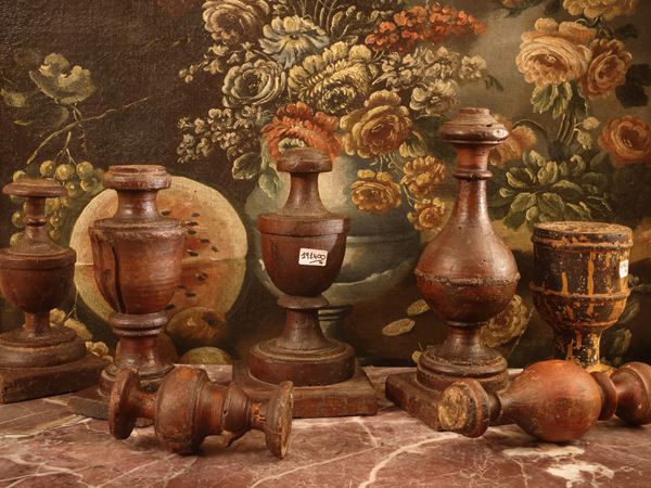 Series of seven antique wooden candlesticks