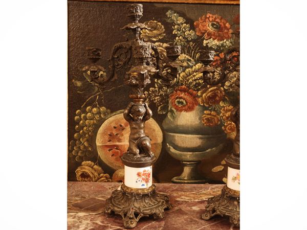 Candlesticks in burnished metal and porcelain