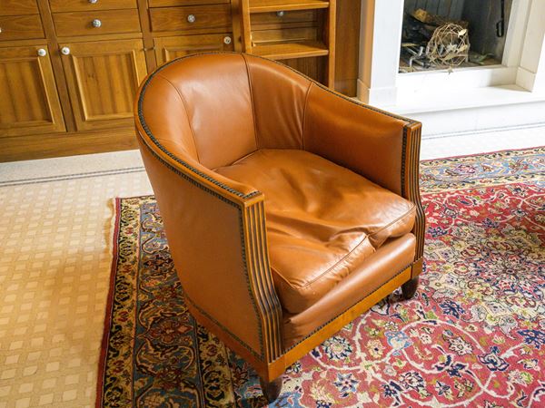 Tub armchair in tan leather
