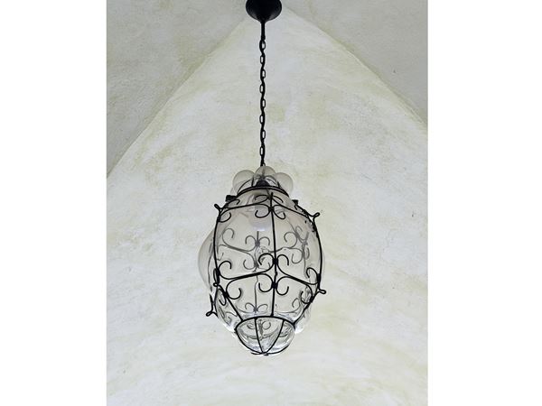 Lantern in blown glass and wrought iron