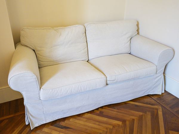 Upholstered two-seater sofa
