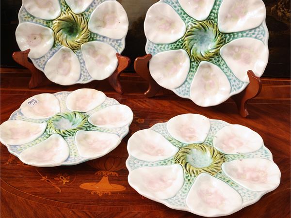 Series of four majolica oyster plates