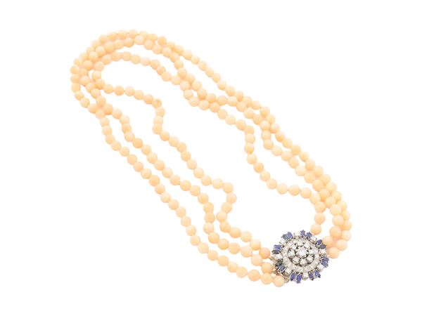 Three-strand of pink Asian coral necklace with clasp in white gold, diamonds and sapphires