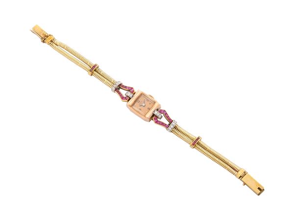 Lady's watch in 14K yellow and red gold, diamonds and rubies