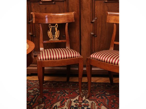 Series of four cherry wood chairs