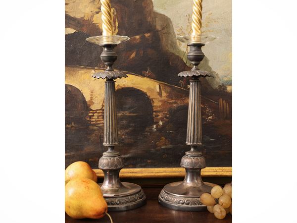 Pair of silver metal candlesticks