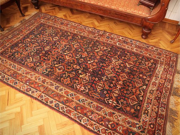 Old-fashioned Caucasian carpet
