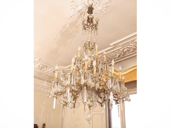 Large chandelier in golden metal and glass