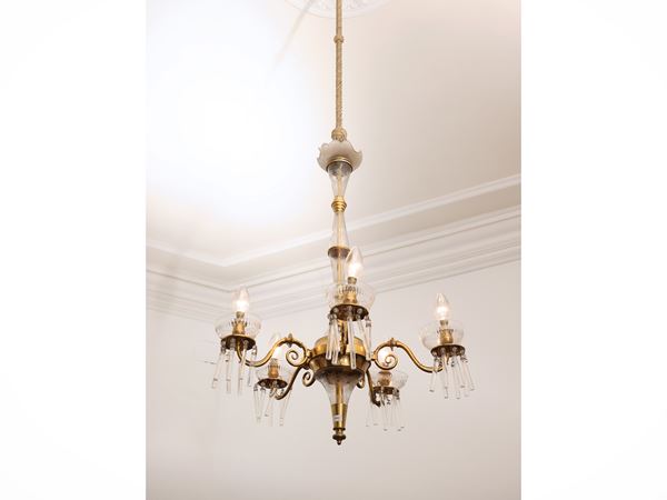 Lamp in golden metal and crystal