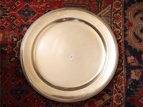 Large round silver tray in the Empire style